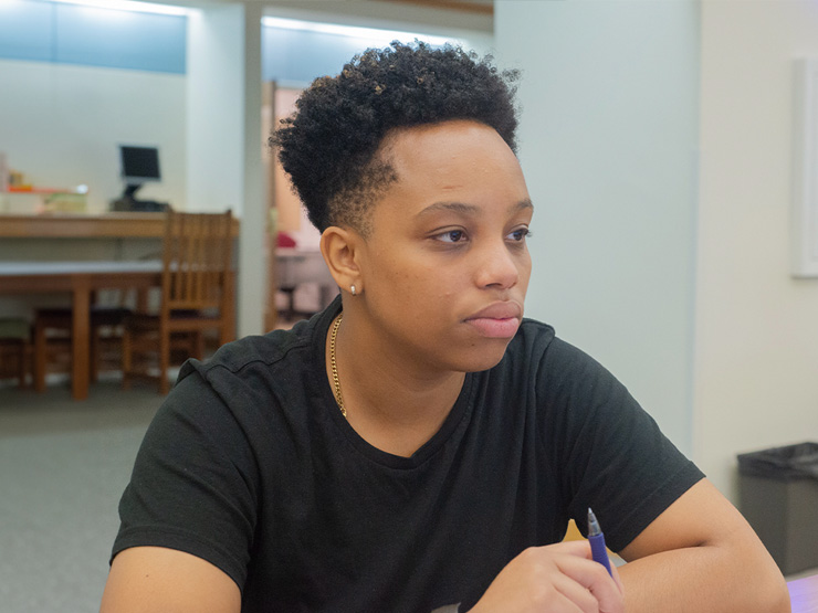 Booth conducting summer research in Trexler Library in 2018.