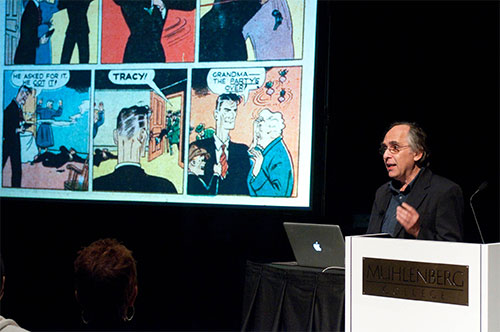 Art Spiegelman standing at podium speaking to audience