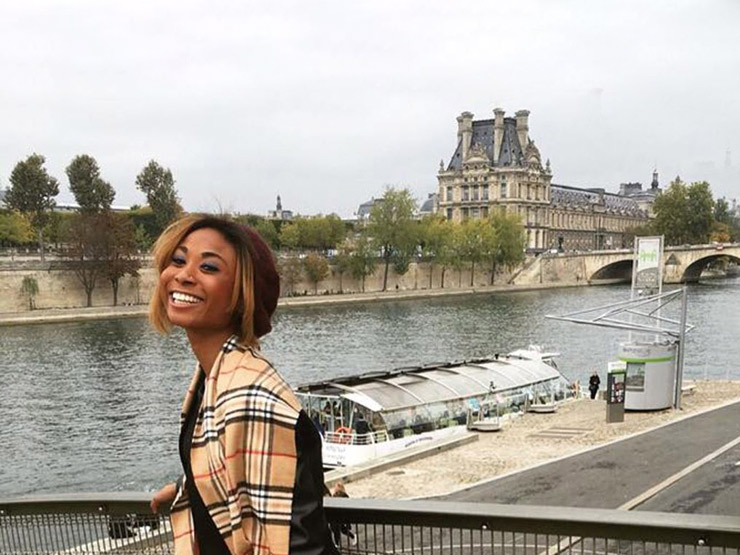 Student posing in front of canal