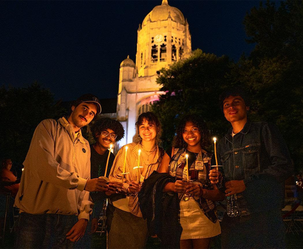 Students at night Haas in background