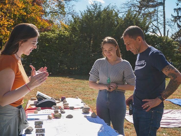 A pair of college students who are leaders in a tree tracking and Indigenous heritage project speak with the mayor of Allentown.