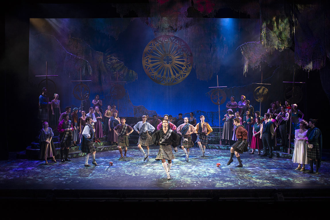 Dancers performing on stage in Brigadoon