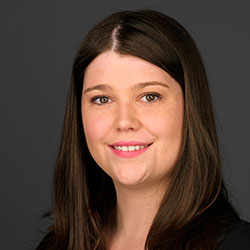 A headshot of Haley Brown, who has long, straight, dark hair