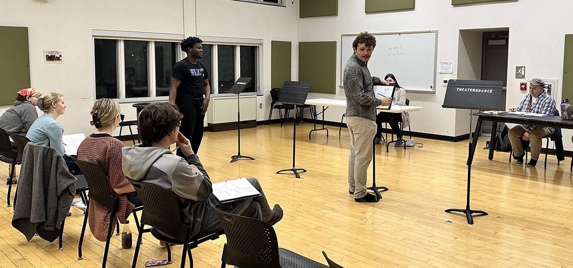 Photo of actors rehearsing in a rehearsal studio.