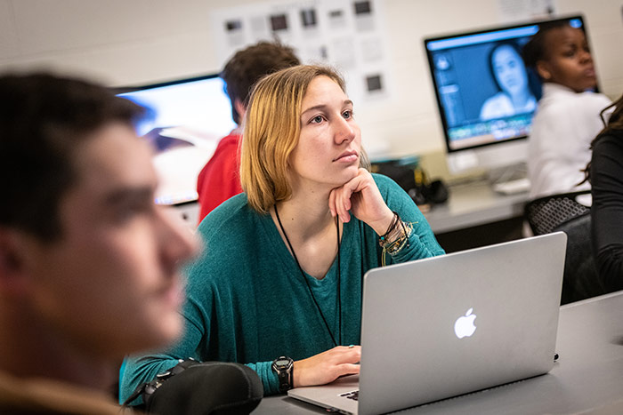 Student in classroom working on a computer